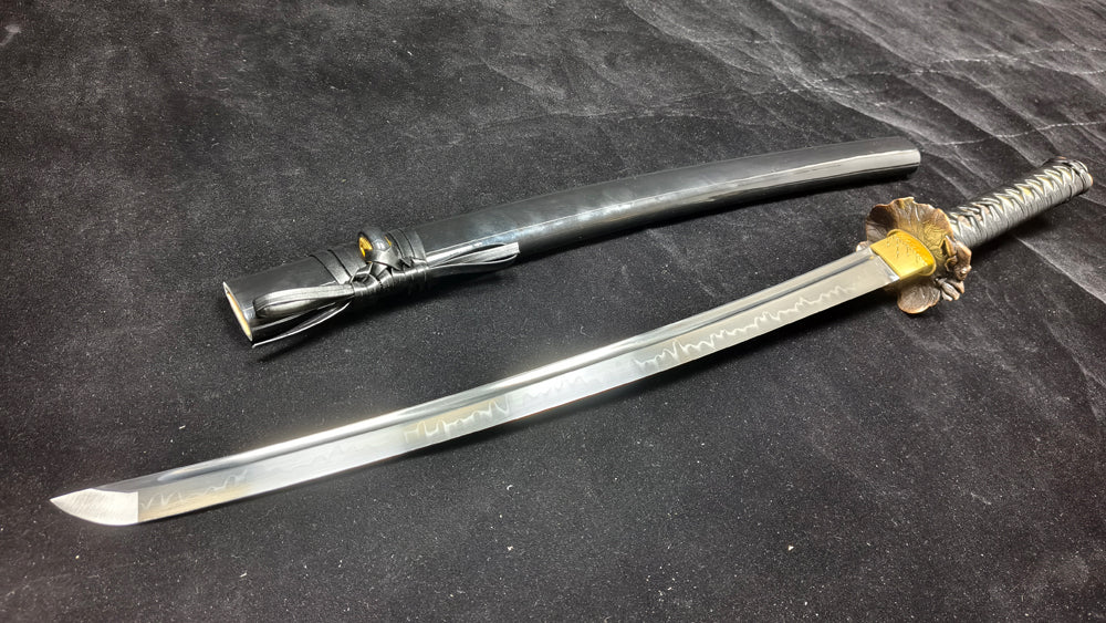 (T10 mulches soil, burning blades to create a ripple pattern)katana