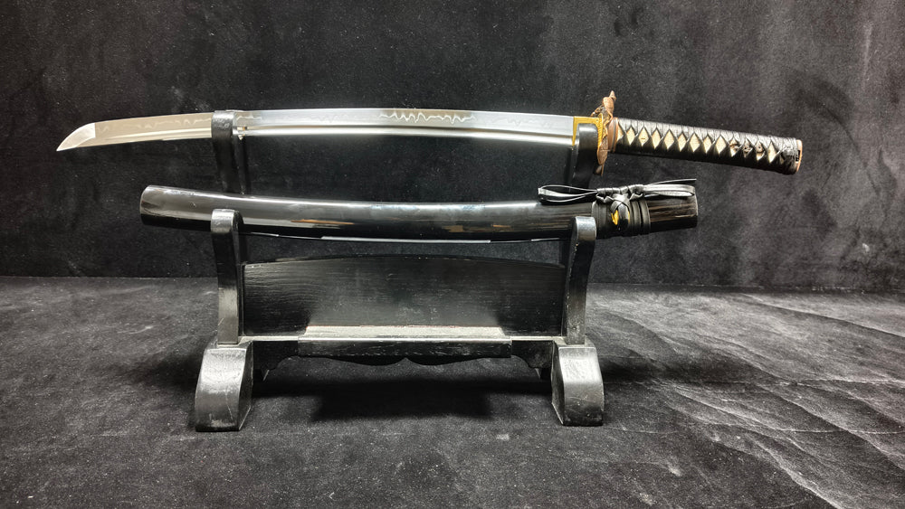 (T10 mulches soil, burning blades to create a ripple pattern)katana
