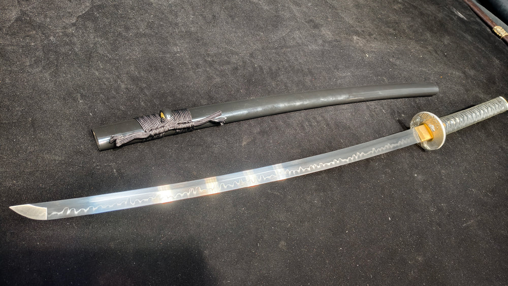 TI0 (covered with soil and burned to create the blade's ripple pattern)katana