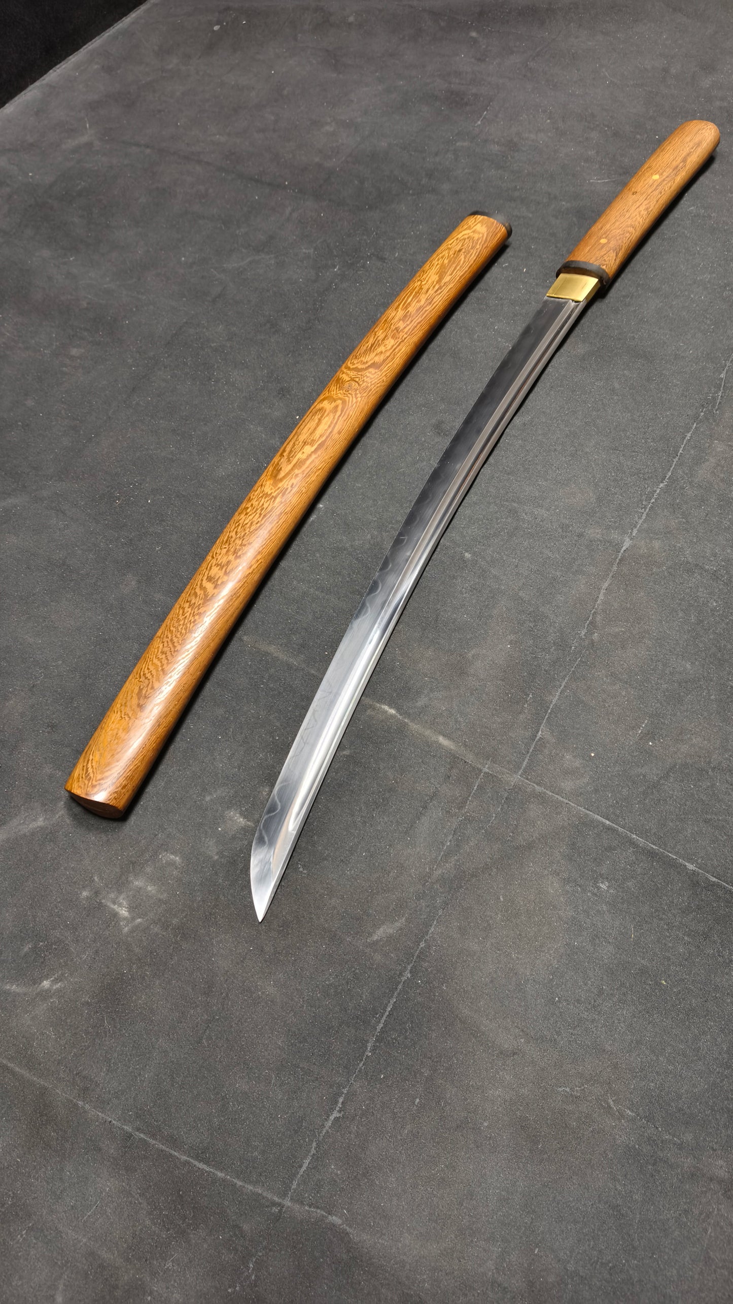 TI0 (covered with soil and burned to create the blade's ripple pattern)katana